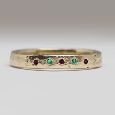 Sandcast Yellow Gold Ring with Flush Set Rubies & Emeralds
