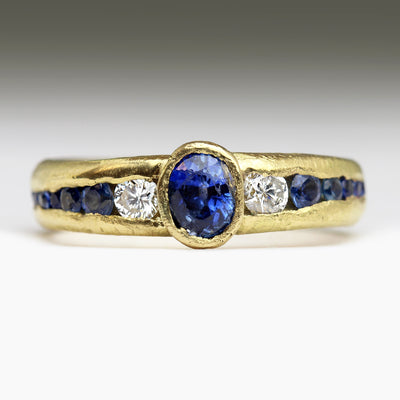 18ct Yellow Gold Sandcast Ring with Oval Sapphire & Tapered Channel of Diamonds & Sapphires