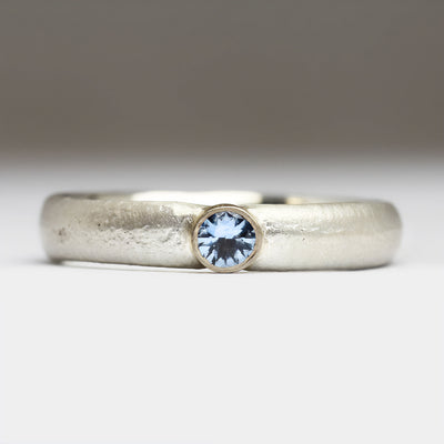 Silver Sandcast Ring with Bezel Set Pale Blue Sapphire & Laser Engraved Image