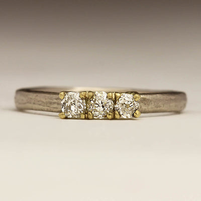 18ct White Gold Sandcast Ring with Three 3mm Diamonds in 18ct Yellow Gold Claw Setting