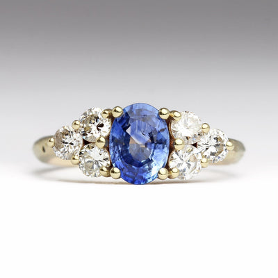 Sandcast Engagement Ring with Oval Blue Sapphire & Six White Diamonds