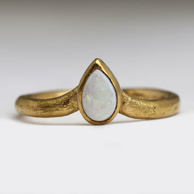 22ct Yellow Gold Sandcast Wishbone Engagement Ring with Pear Shaped Own Opal Bezel Set