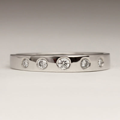Polished Platinum Wedding Ring with 2.5 and 2.1 Diamonds Flush Set