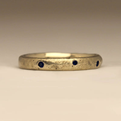 Sandcast 9ct White Gold Wedding Ring with Random Flush Set Sapphires