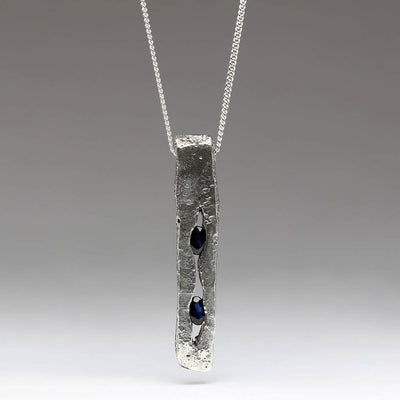 Sandcast Crevice Pendant Made From Mix of Silver & 9ct White Gold with Own Oval Sapphires