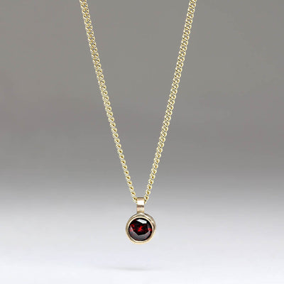 Sandcast Pendant with 4mm Red Garnet
