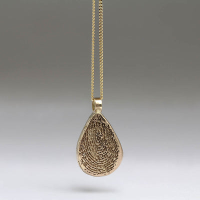 Sandcast Pendants in Heirloom Gold with Laser Engraved Fingerprints