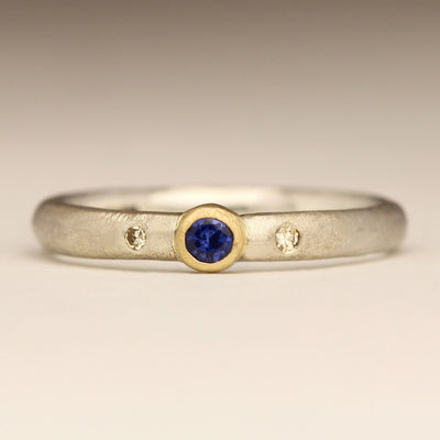 Sandcast Silver Ring with Gold Bezel Set Sapphire and White Diamonds