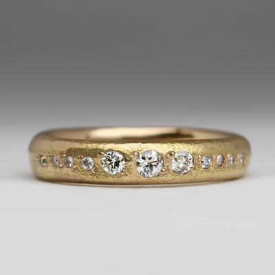 Sandcast Yellow Gold Ring with Pavé Set Size Ascending Diamonds